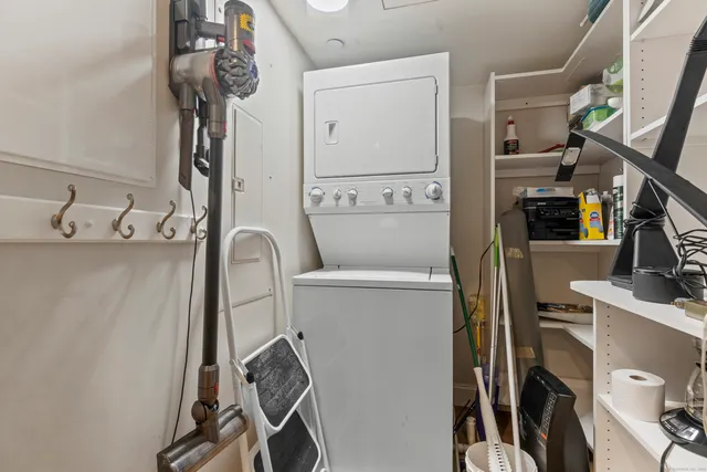 a view of a chairs and table in a backyard