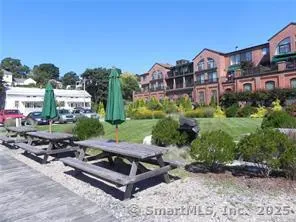 an aerial view of multiple houses with yard