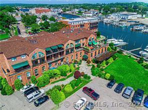 17 Water Street, Unit A10 Groton, CT 06355 - Photo 24 of 35 an aerial view of multiple houses with yard