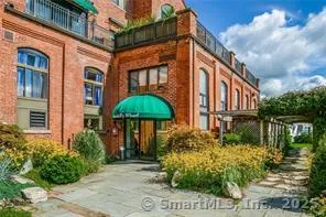 an aerial view of a house with a garden and plants