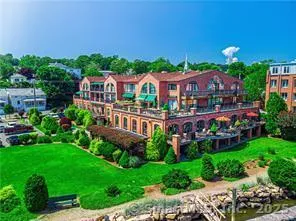 an aerial view of a house with a garden and swimming pool