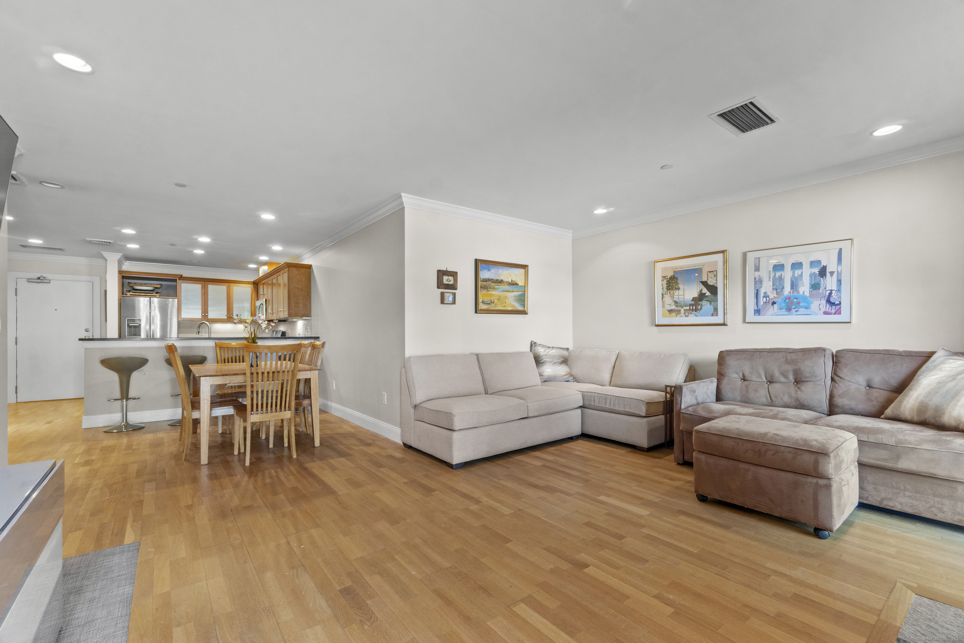 17 Water Street, Unit A10 Groton, CT 06355 - Photo 4 of 35 a living room with furniture and a wooden floor