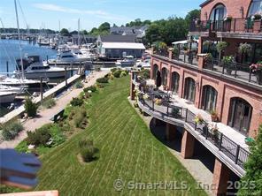 17 Water Street, Unit A10 Groton, CT 06355 - Photo 10 of 35 a balcony with tall trees