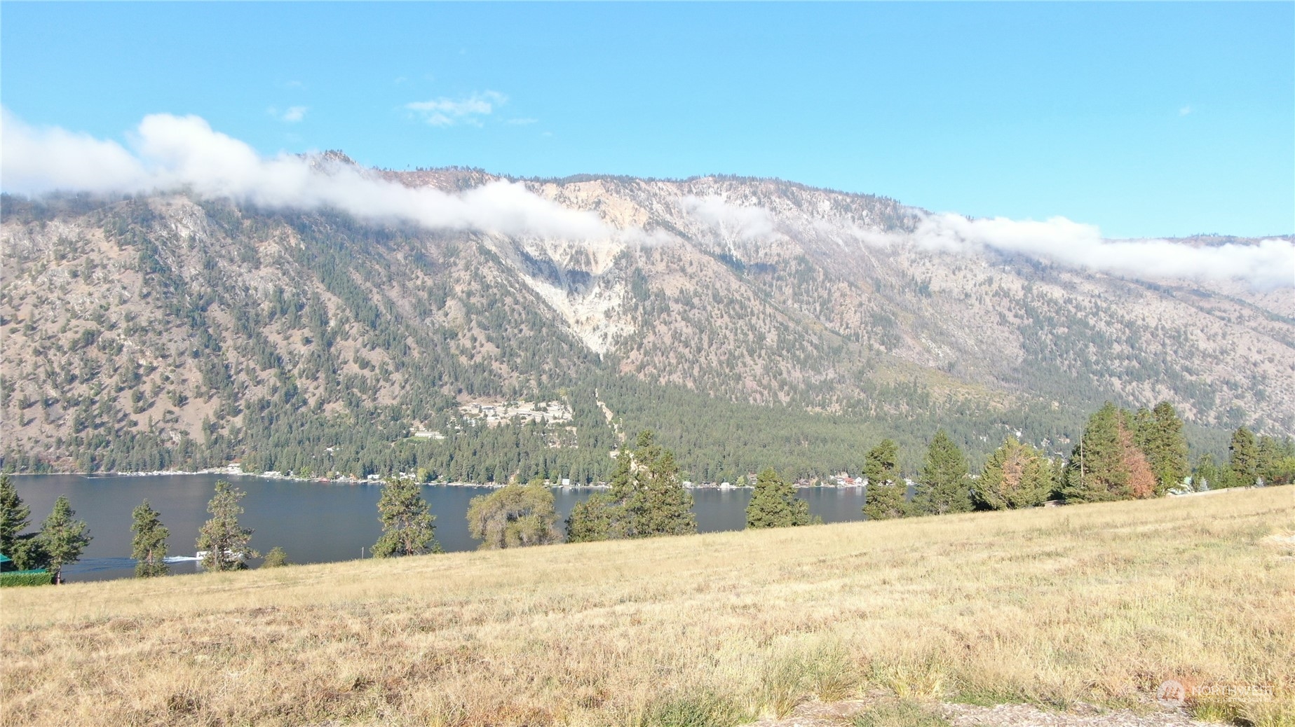 1507 Summit Boulevard Manson, WA 98831 - Photo 6 of 10 a view of lot of snow and trees in the background