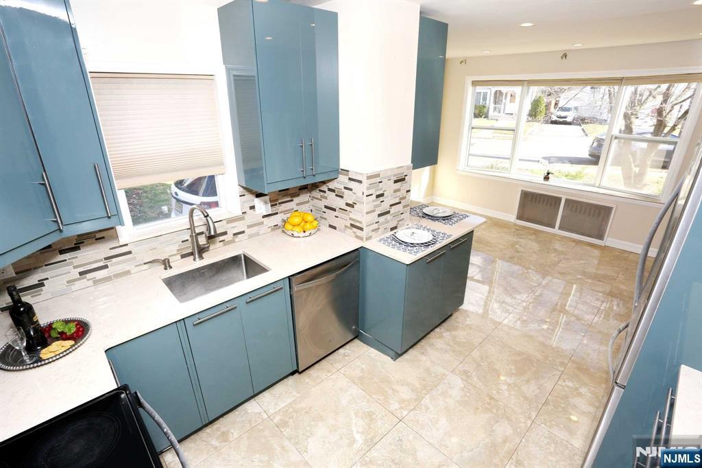 a view of a kitchen with a sink and a window