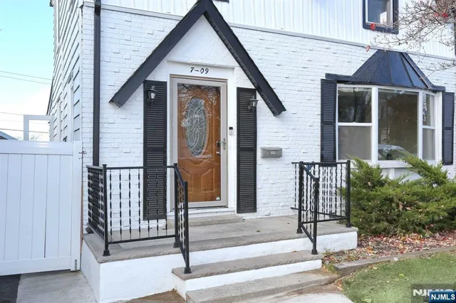 a front view of a house with a porch