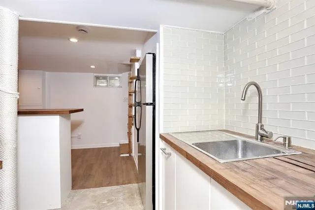 a view of a kitchen with a sink