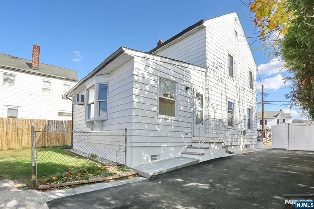 a view of a house with a street
