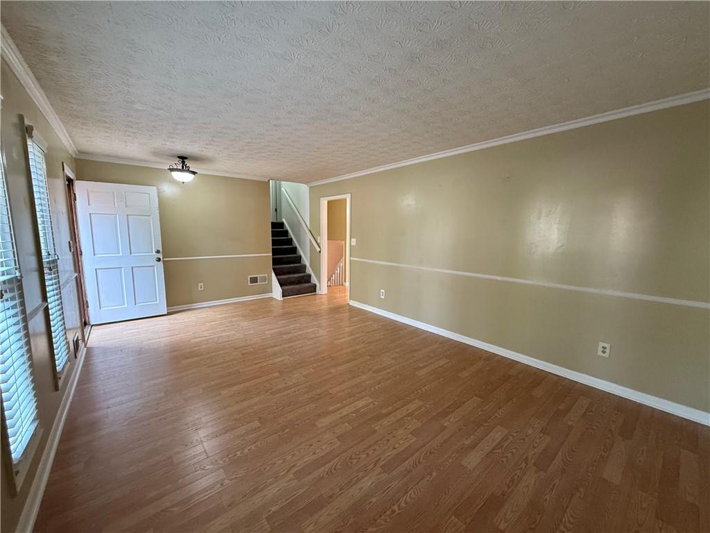 7719 Glen Devon Road Jonesboro, GA 30236 - Photo 7 of 37 a view of an empty room with wooden floor