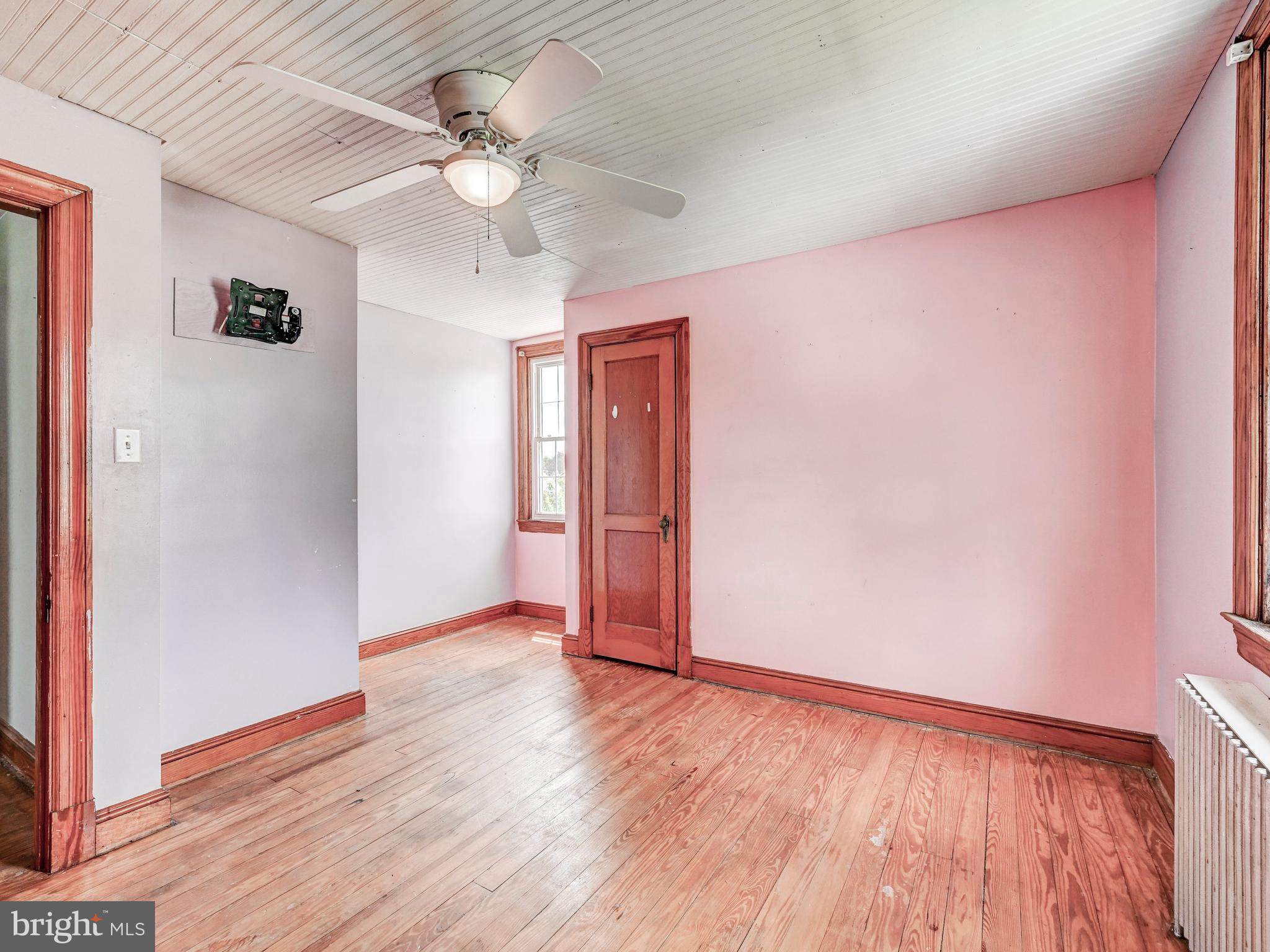 3206 Lynch Road Baltimore, MD 21219 - Photo 31 of 70 wooden floor in an empty room with a window