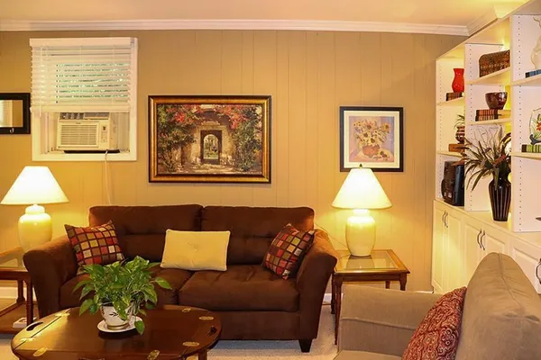 a living room with furniture and a large window