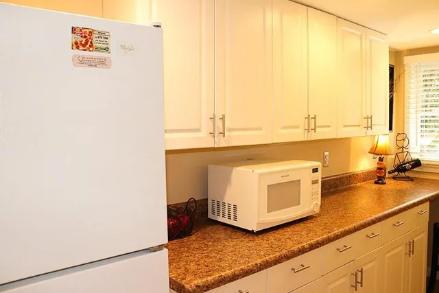 a kitchen with stainless steel appliances a sink and a cabinets