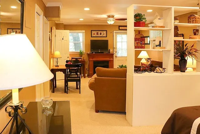 a view of living room filled with furniture and a flat screen tv