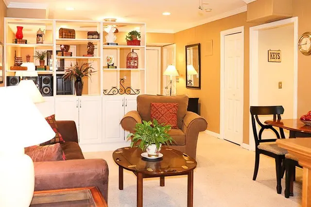 a dining room with furniture and wooden floor