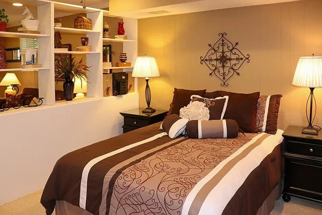 a bed room with a bed and a lamp