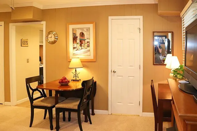 a dining room with furniture and window