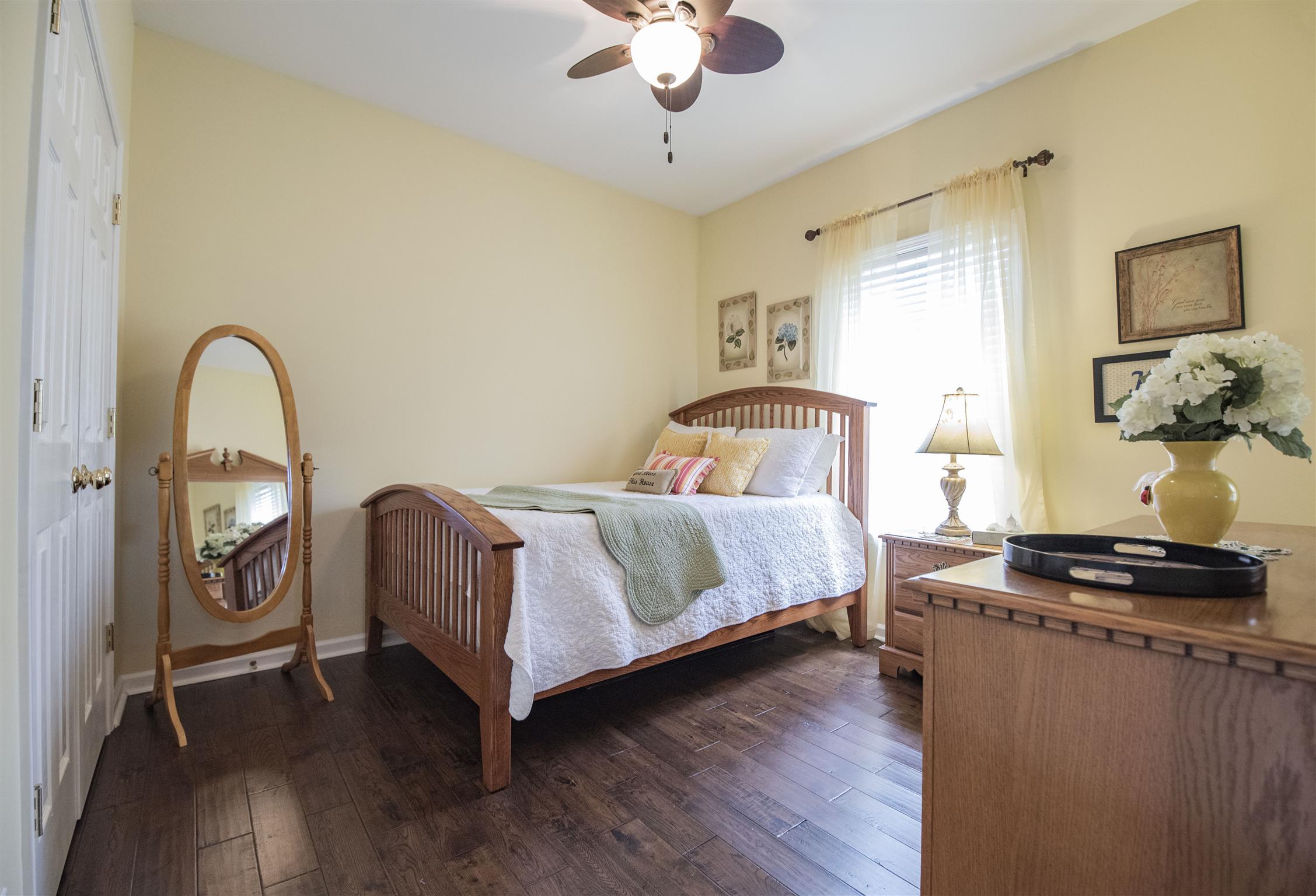 10600 Taylor Road Rockvale, TN 37153 - Photo 16 of 30 The third bedroom has cool paint tones, ceiling fan, extra large closet and hardwood floors! All bedrooms are are the main level! 10600 Taylor Rd, Rockvale, TN 37153