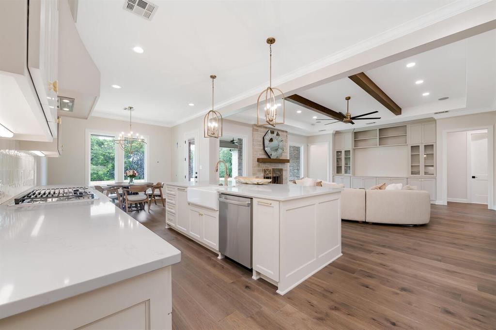 8005 Bee Cave Road China Spring, TX 76633 - Photo 40 of 40 a large white kitchen with a large window a sink and stainless steel appliances