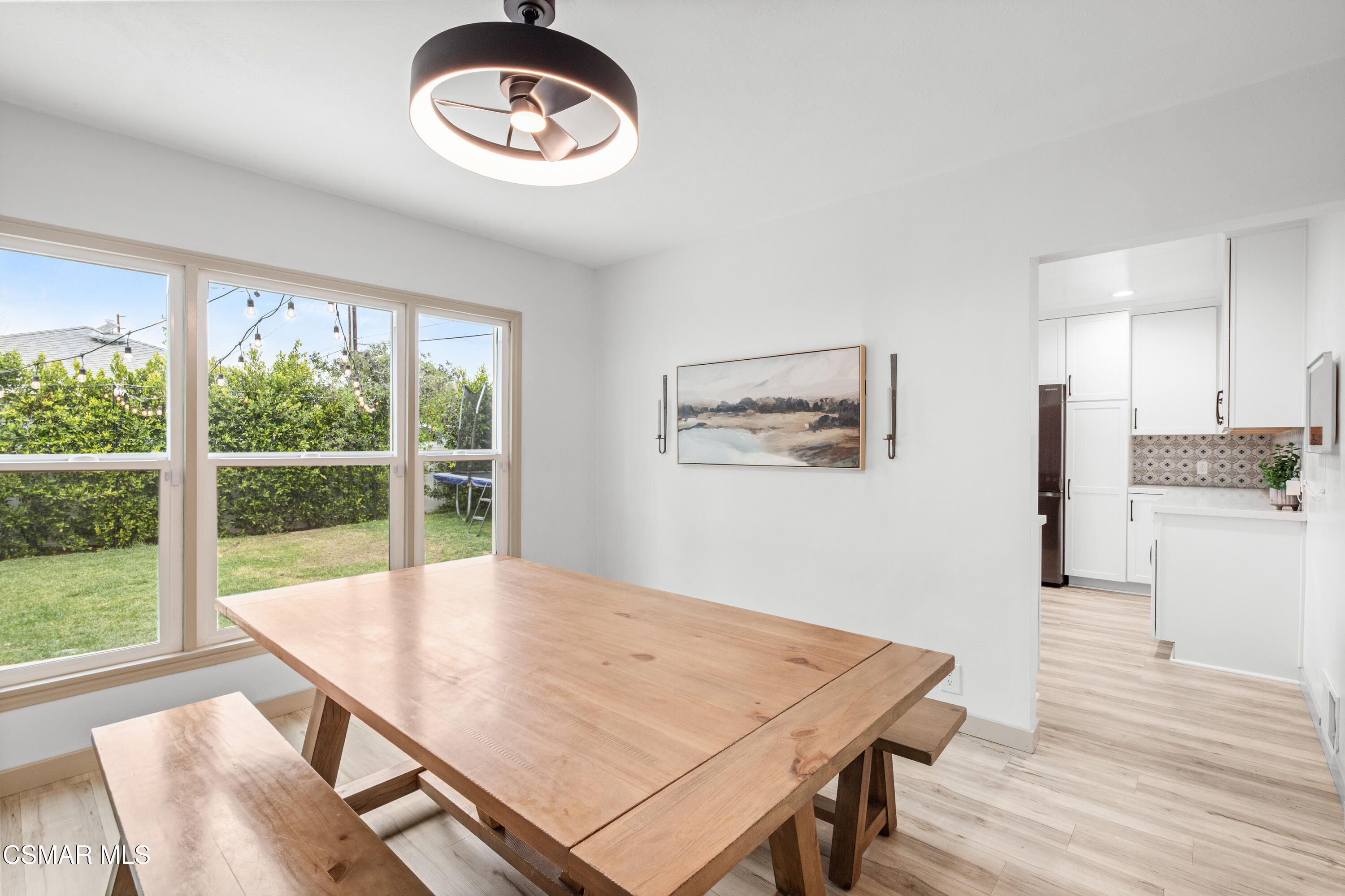 4391 Adam Road Simi Valley, CA 93063 - Photo 12 of 30 a view of a dining room with furniture window and wooden floor