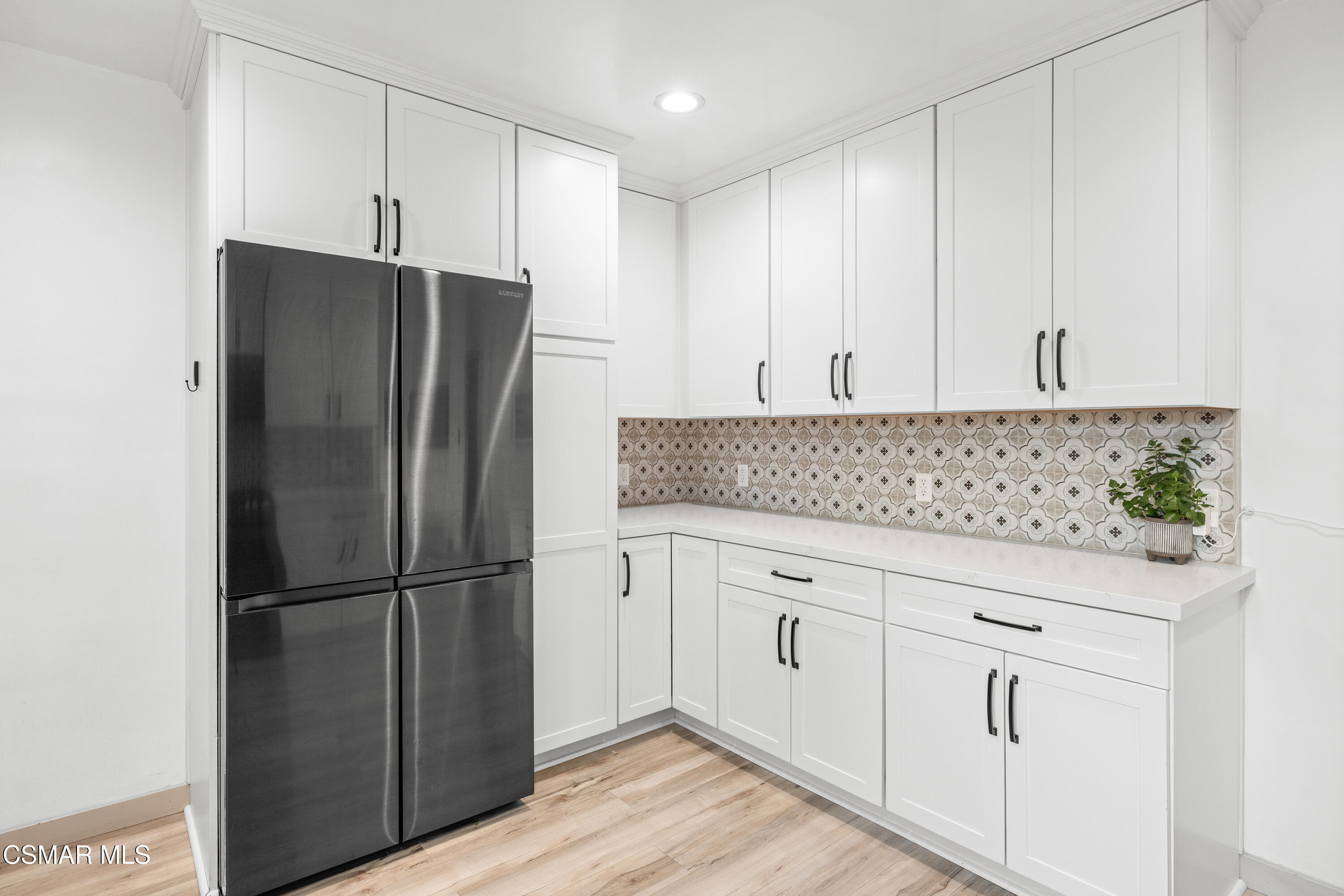 4391 Adam Road Simi Valley, CA 93063 - Photo 15 of 30 a kitchen with granite countertop white cabinets and stainless steel appliances