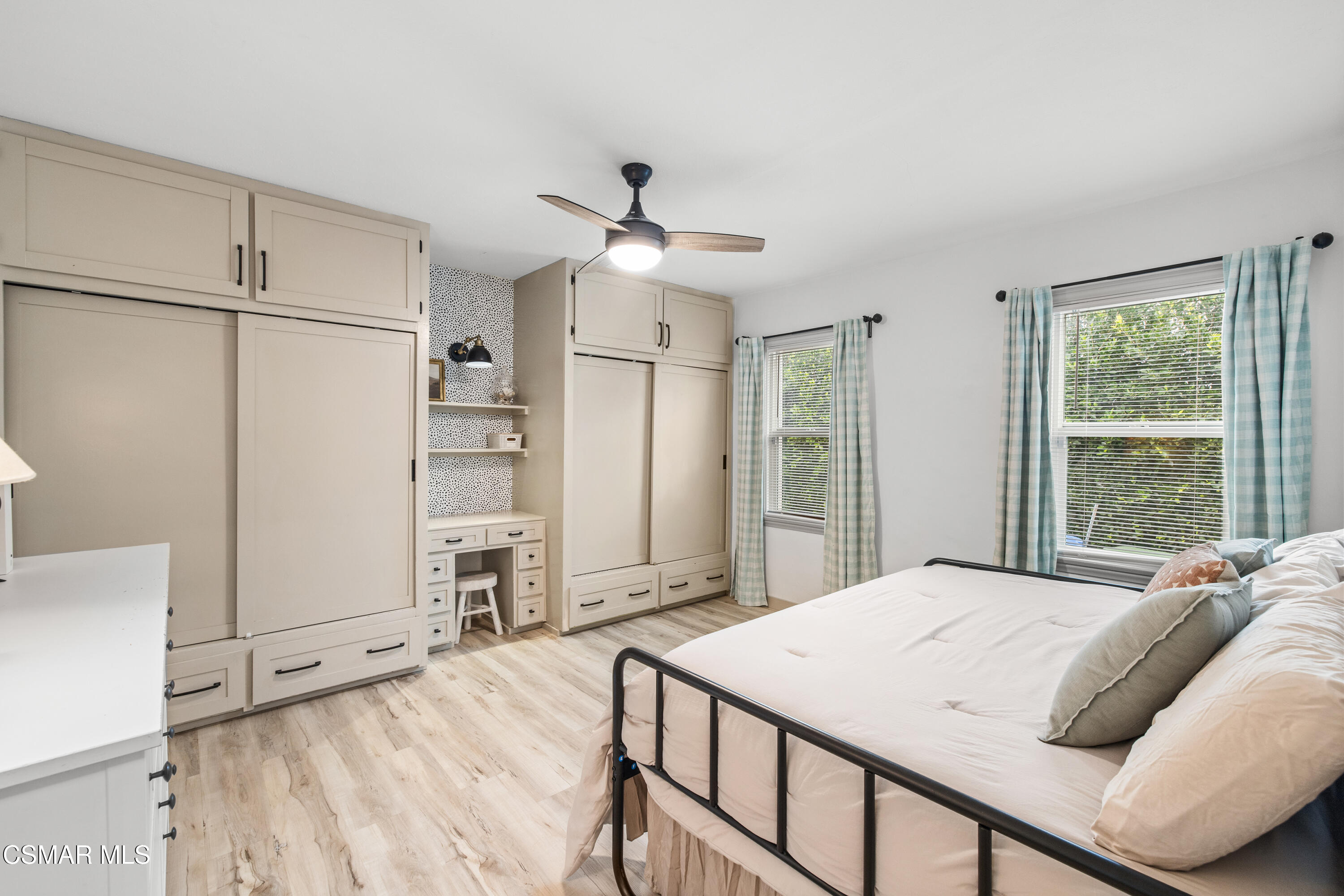4391 Adam Road Simi Valley, CA 93063 - Photo 20 of 30 a bedroom with a large bed and a chandelier