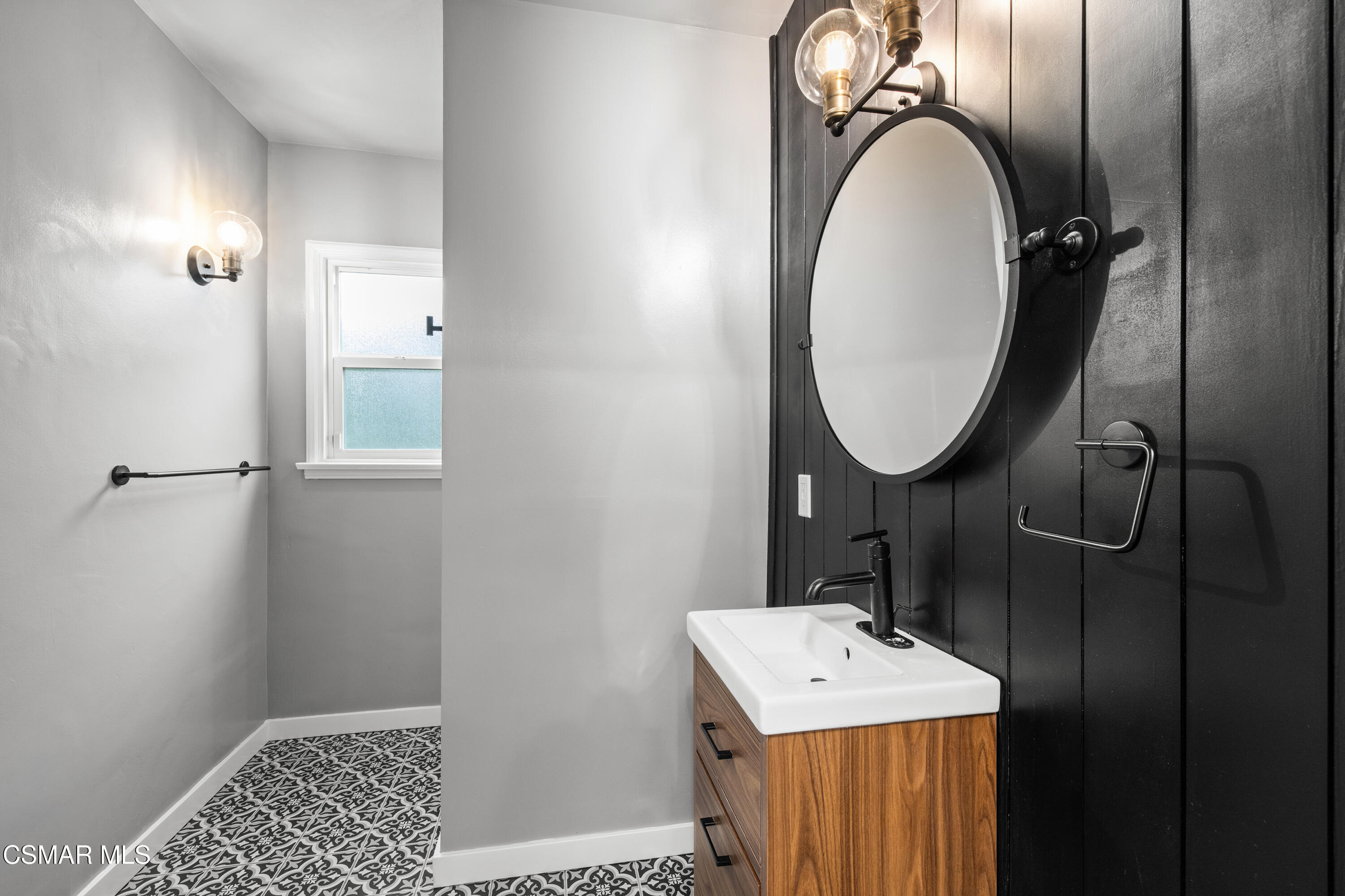 4391 Adam Road Simi Valley, CA 93063 - Photo 22 of 30 a bathroom with a sink a mirror and a shower