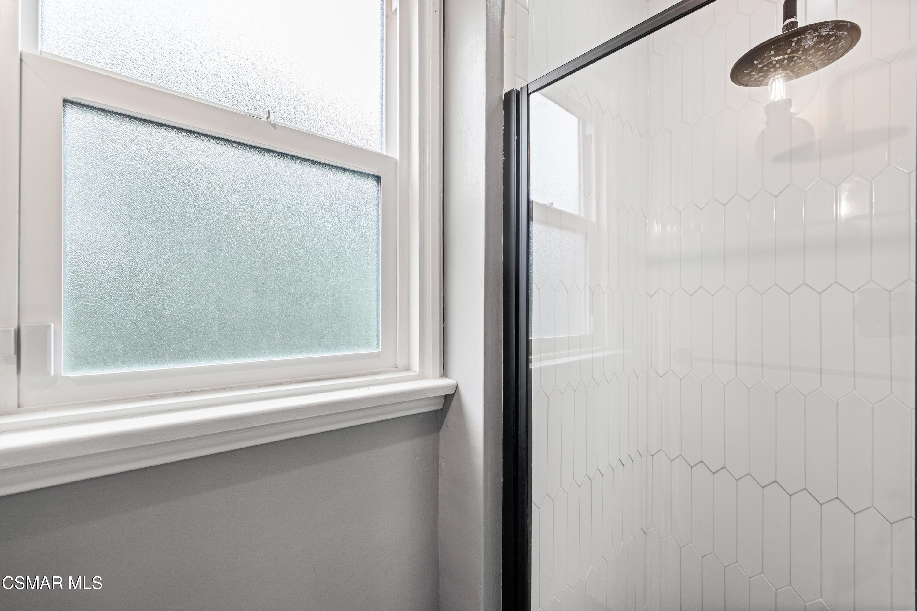 4391 Adam Road Simi Valley, CA 93063 - Photo 23 of 30 a bathroom with a shower and a mirror