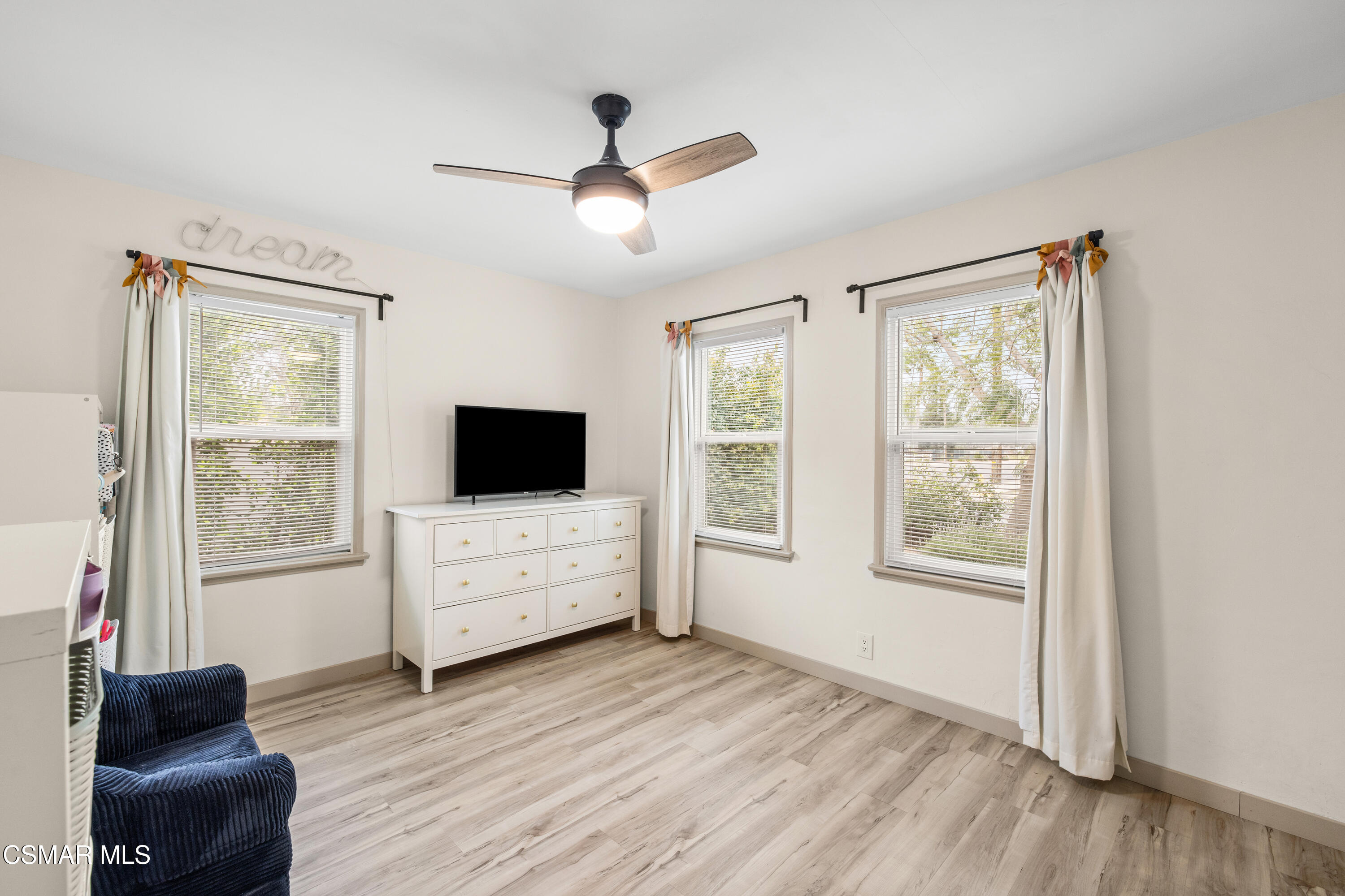 4391 Adam Road Simi Valley, CA 93063 - Photo 24 of 30 a living room with furniture and a flat screen tv