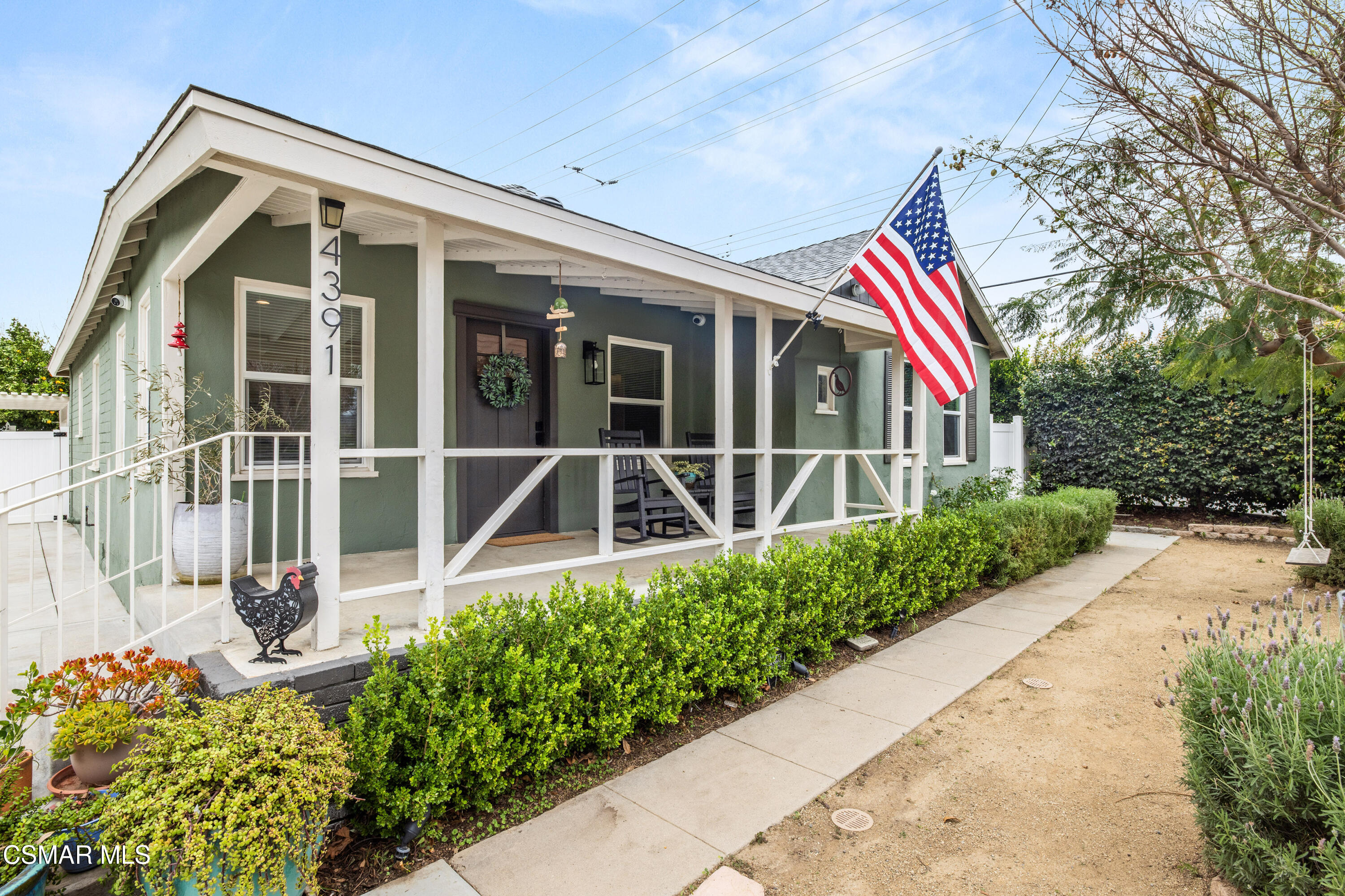4391 Adam Road Simi Valley, CA 93063 - Photo 5 of 30 a front view of a house with a yard and potted plants