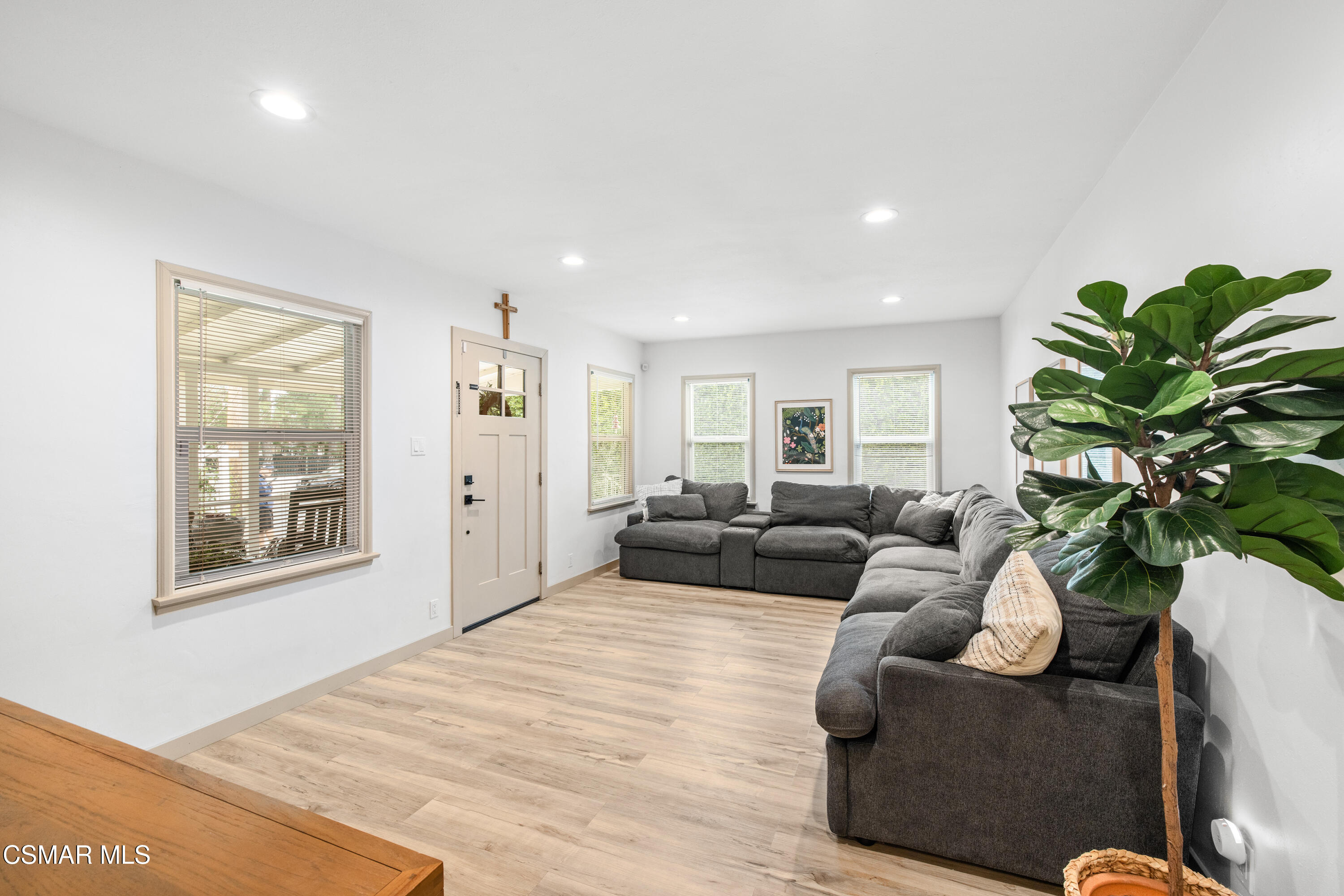 4391 Adam Road Simi Valley, CA 93063 - Photo 8 of 30 a living room with furniture a potted plant and a wooden floor