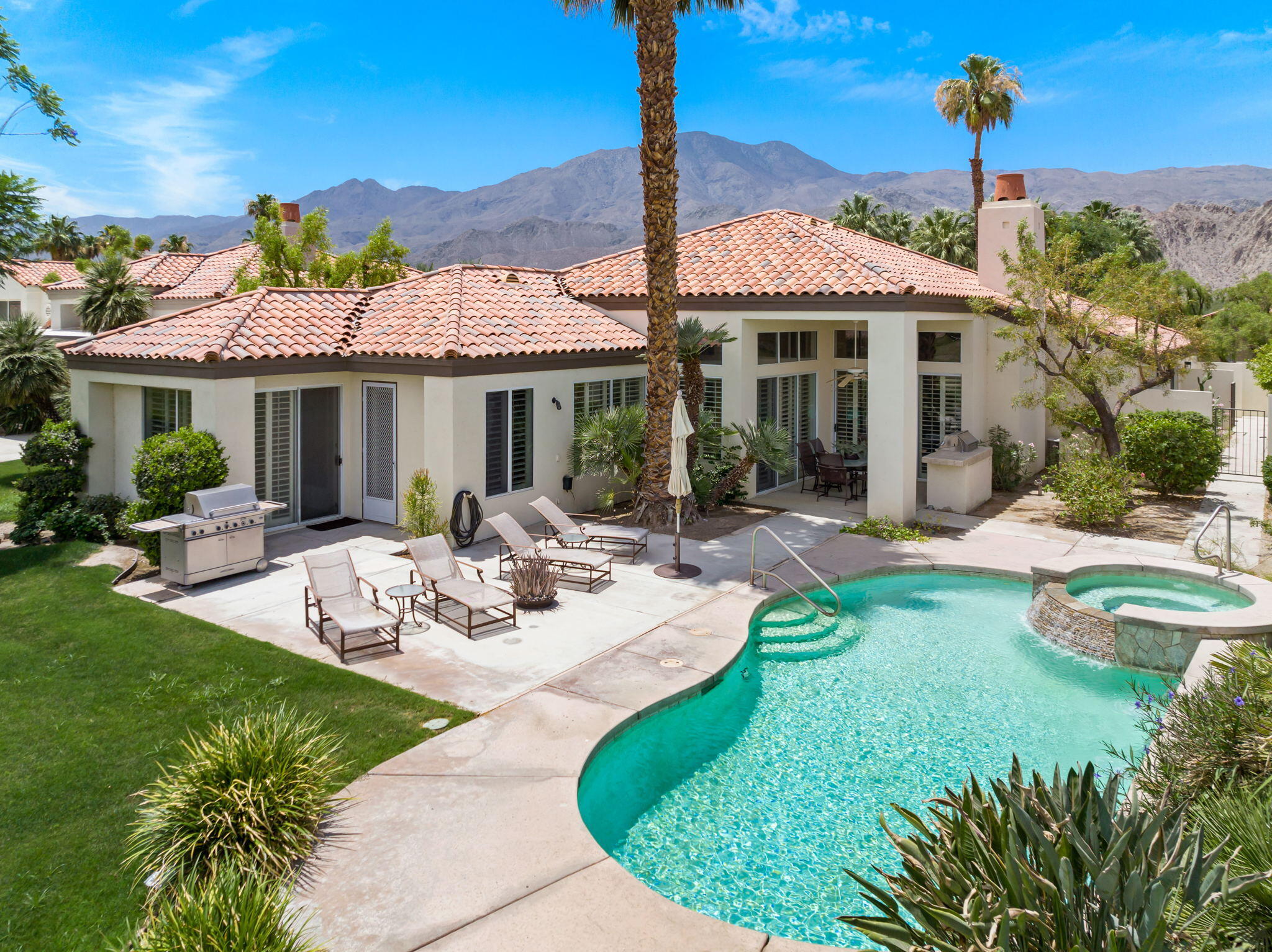 57084 Merion La Quinta, CA 92253 - Photo 12 of 56 a view of a house with backyard sitting area and garden