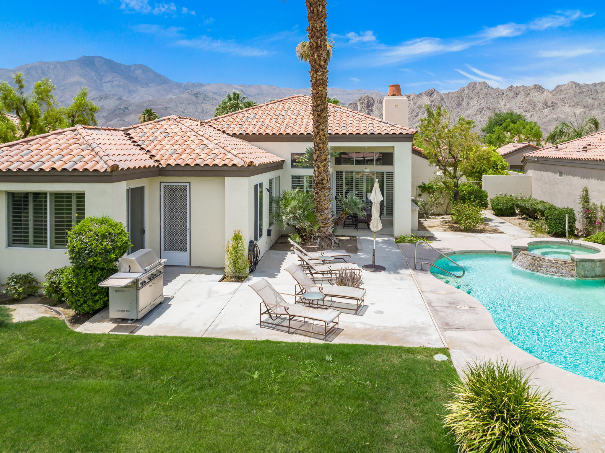 57084 Merion La Quinta, CA 92253 - Photo 14 of 56 a view of a house with garden and a patio