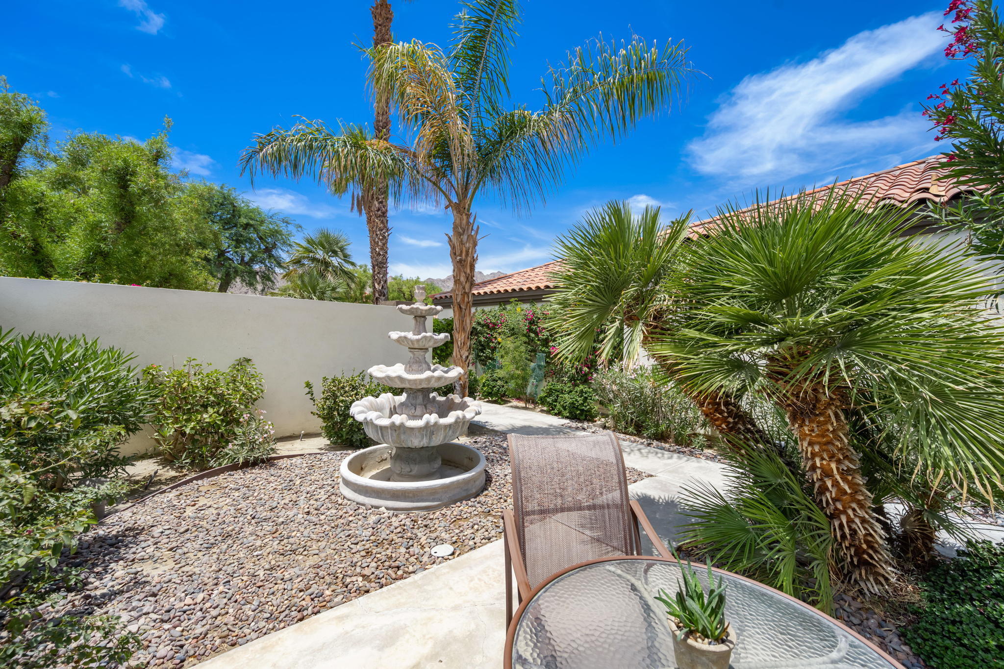 57084 Merion La Quinta, CA 92253 - Photo 21 of 56 a view of a backyard with plants and outdoor seating