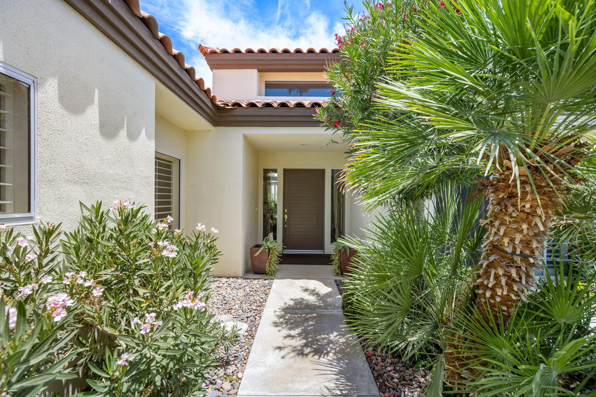 57084 Merion La Quinta, CA 92253 - Photo 22 of 56 a front view of a house with a yard