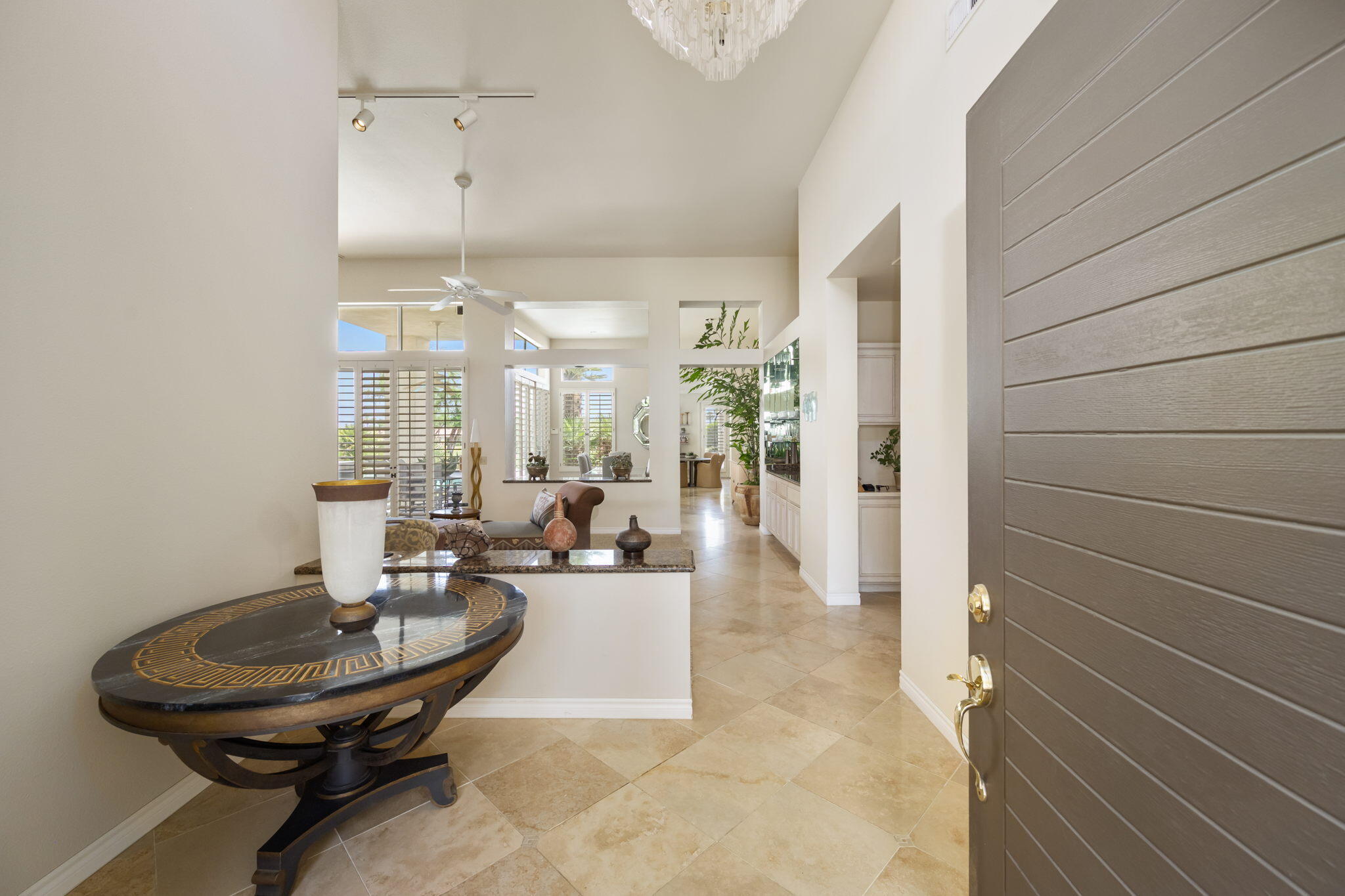 57084 Merion La Quinta, CA 92253 - Photo 23 of 56 a living room with couches a table and chairs