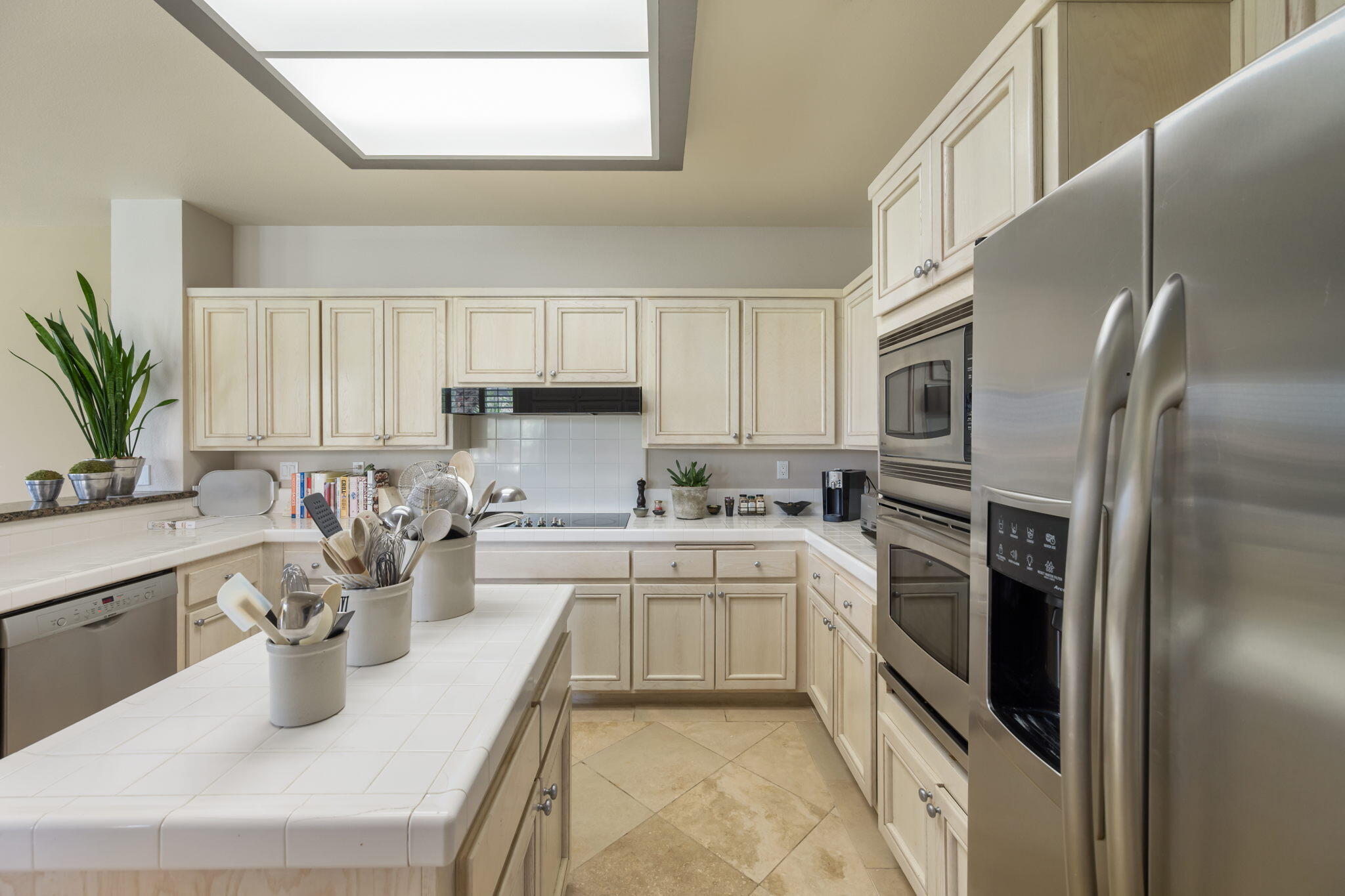 57084 Merion La Quinta, CA 92253 - Photo 36 of 56 a kitchen with a sink stainless steel appliances and cabinets