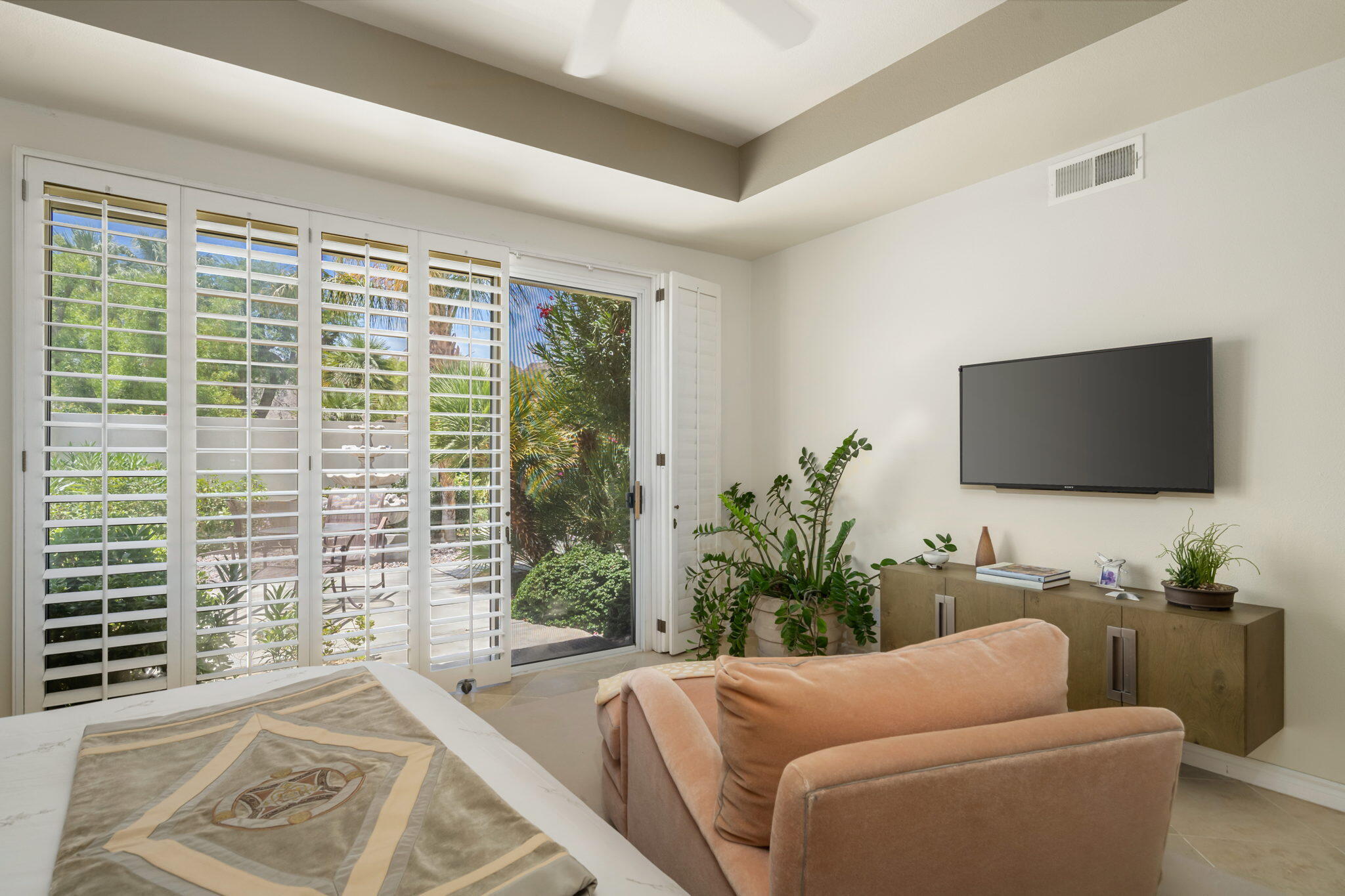 57084 Merion La Quinta, CA 92253 - Photo 47 of 56 a living room with furniture tv and a window