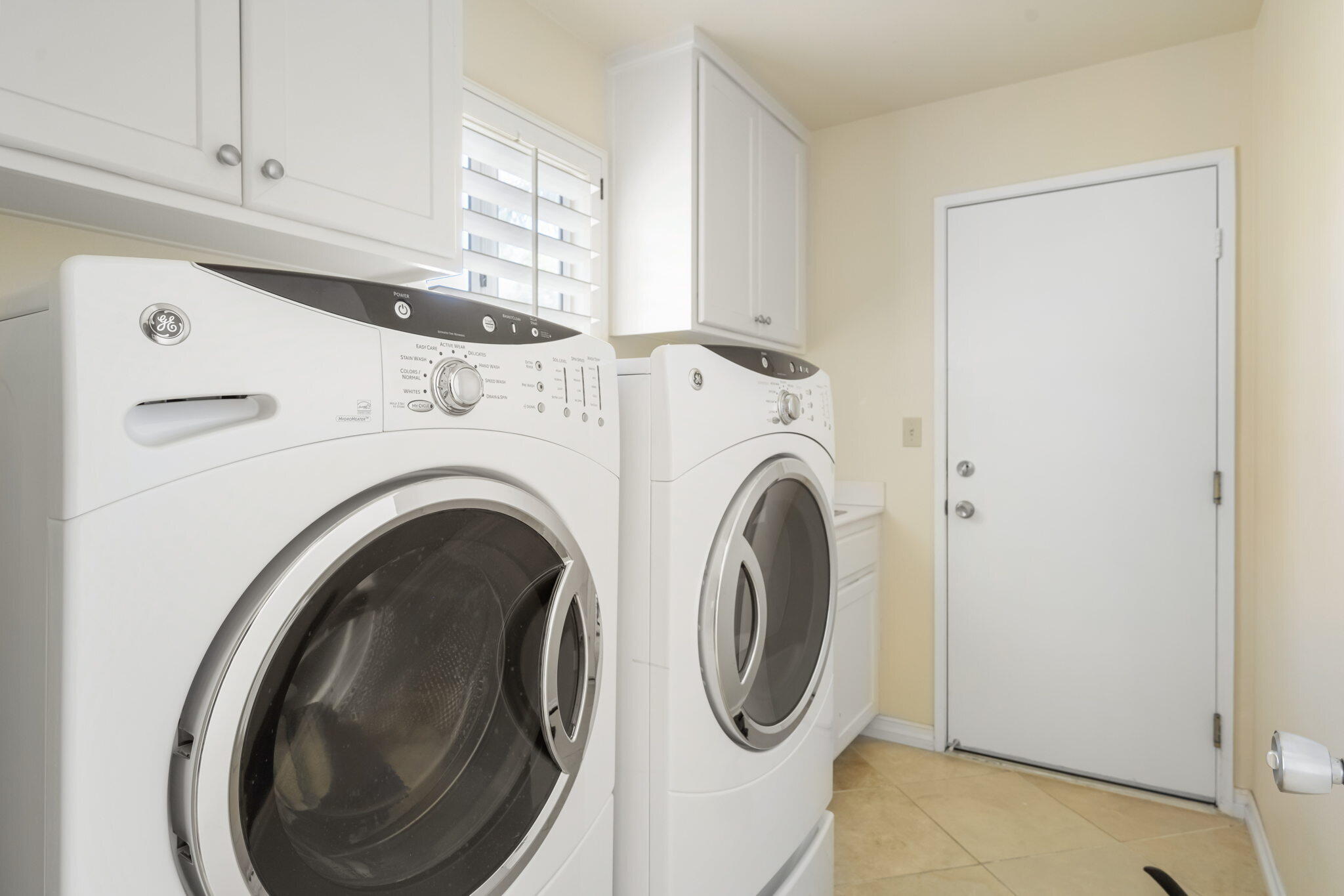 57084 Merion La Quinta, CA 92253 - Photo 53 of 56 a utility room with dryer and washer