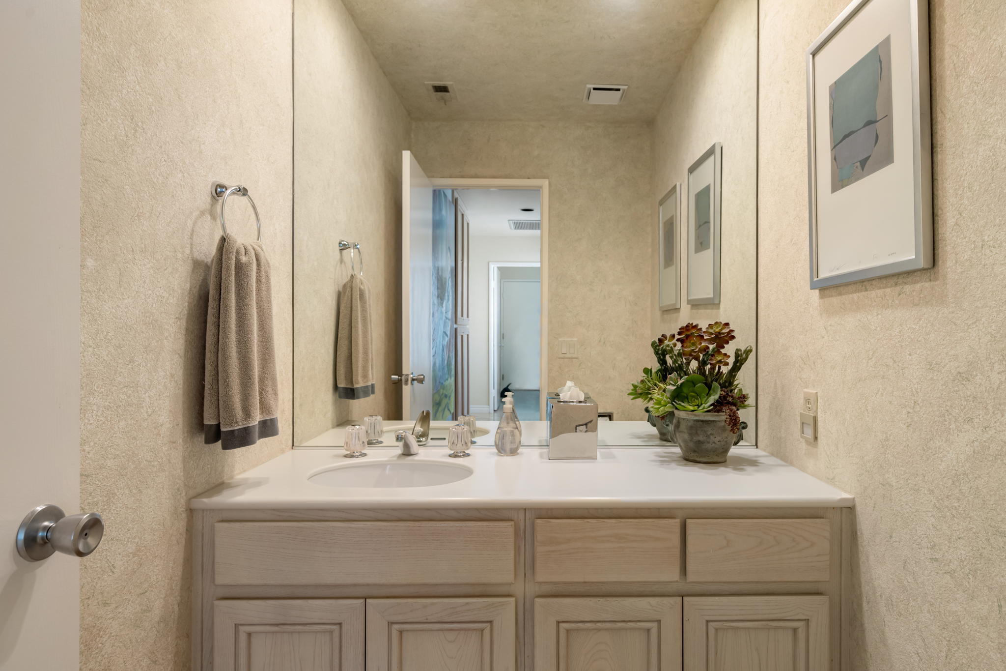 57084 Merion La Quinta, CA 92253 - Photo 54 of 56 a bathroom with a sink and a mirror