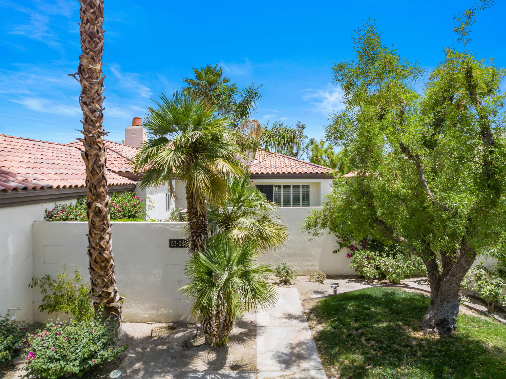 57084 Merion La Quinta, CA 92253 - Photo 6 of 56 a front view of a house with a yard