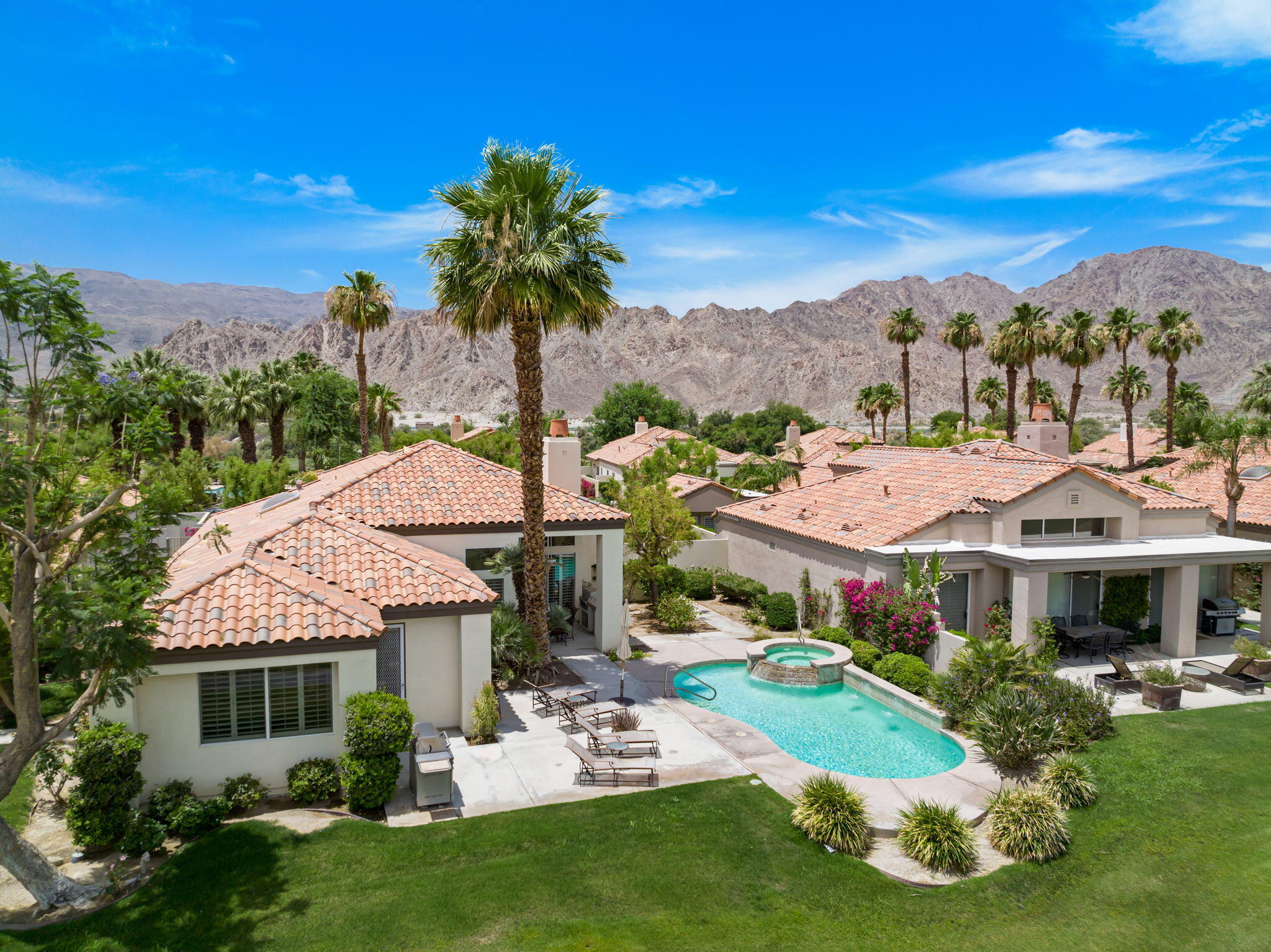 57084 Merion La Quinta, CA 92253 - Photo 10 of 56 a front view of house with yard and green space