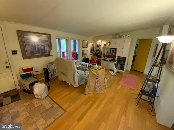 a living room with lots of furniture and gym equipment