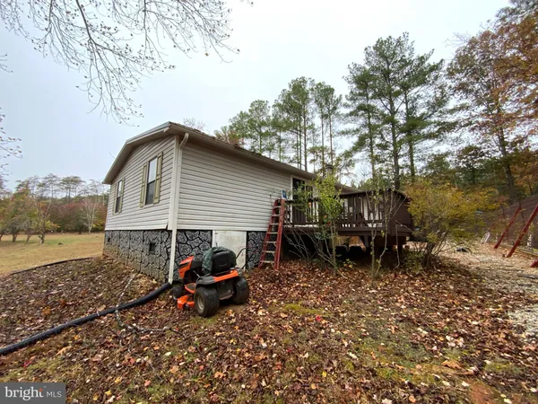 a view of outdoor space with garden and furniture