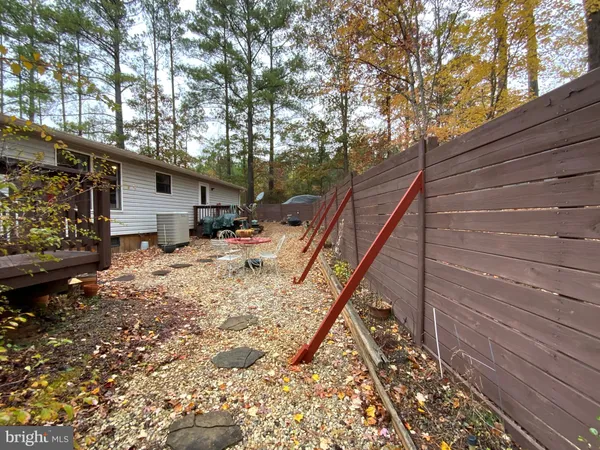 a backyard of a house with seating space