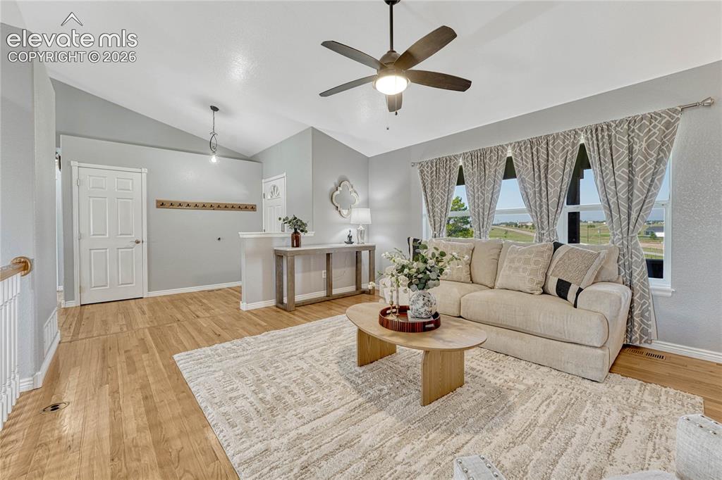 13695 Woodlake Road Elbert, CO 80106 - Photo 5 of 39 ...to oak flooring, vaulted ceilings and Pikes Peak views from the living room.