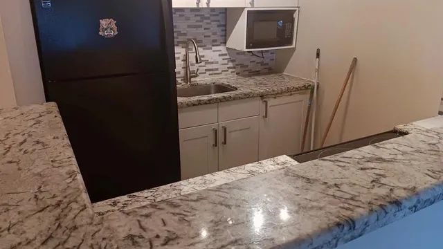 a bathroom with a sink and mirror