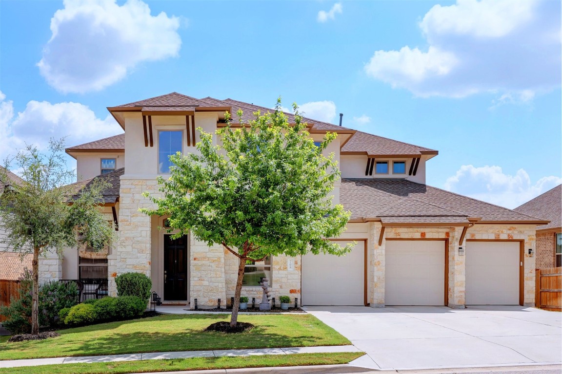 a front view of a house with a yard