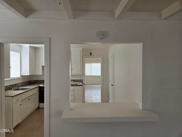 a view of a kitchen from the hallway