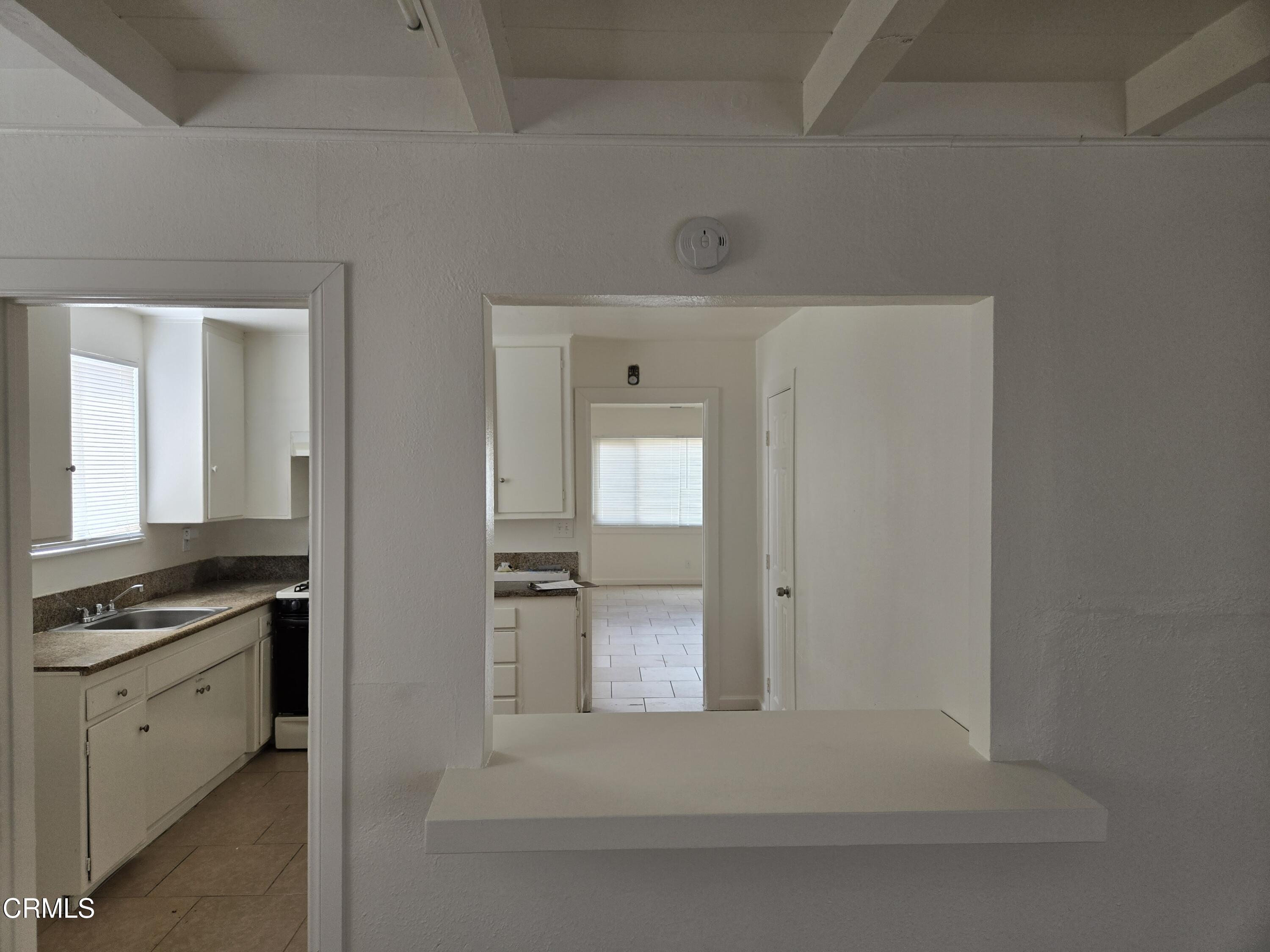 44226 2nd Street East Lancaster, CA 93535 - Photo 6 of 12 a view of a kitchen from the hallway
