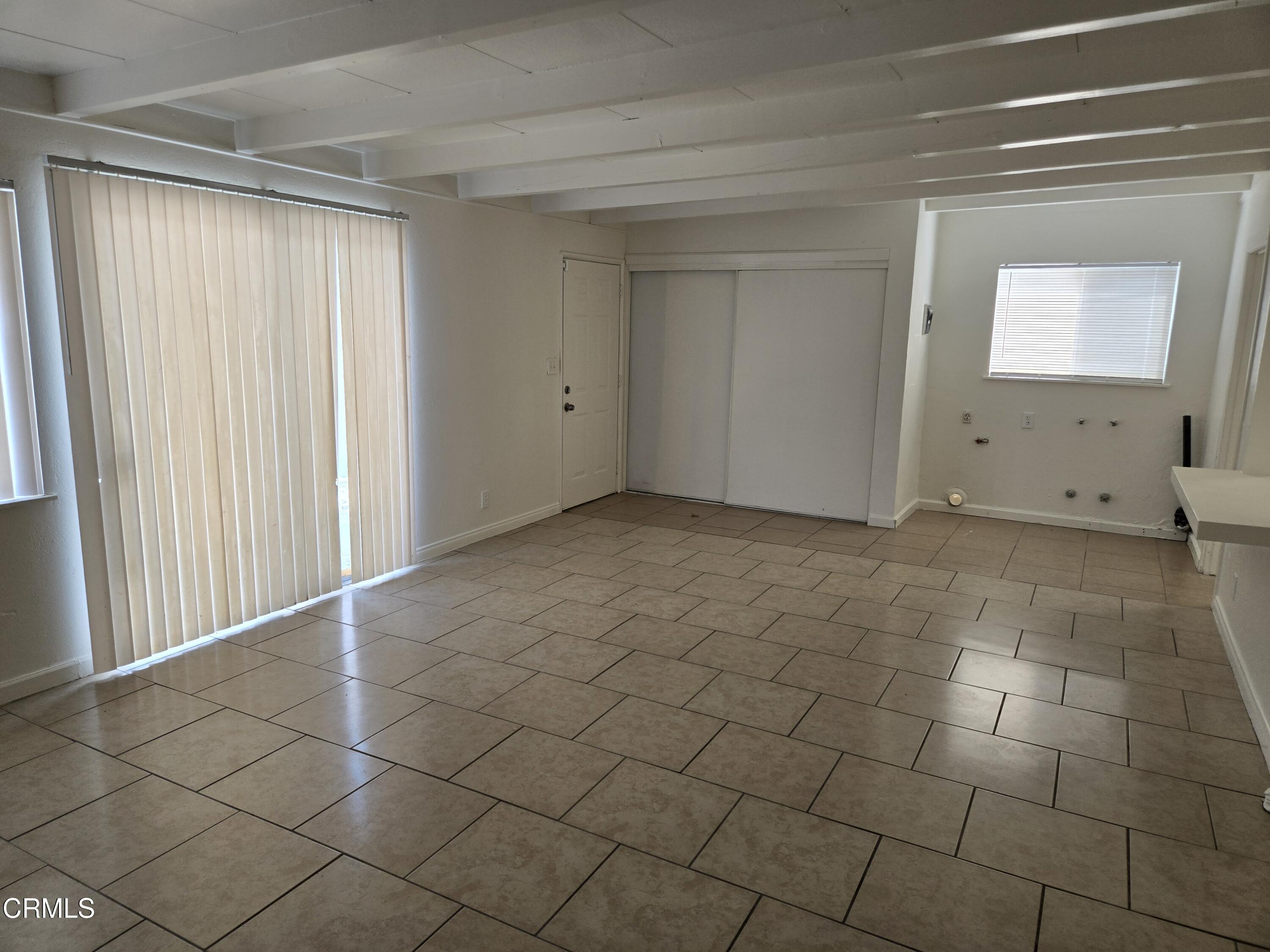 44226 2nd Street East Lancaster, CA 93535 - Photo 7 of 12 a view of an empty room and window